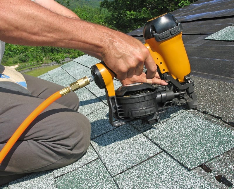roofing contractor installing shingles